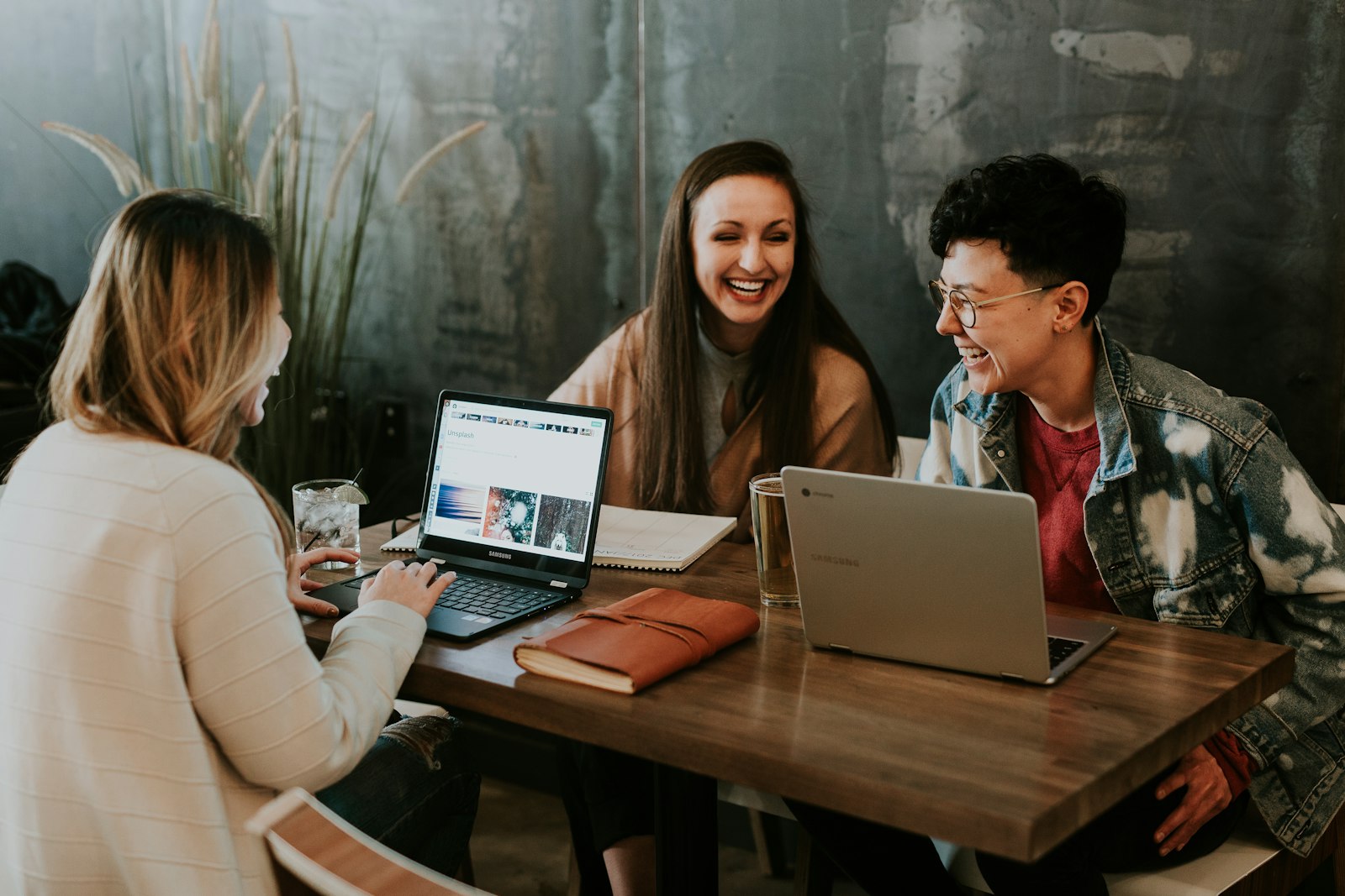 College students collaborating around a product